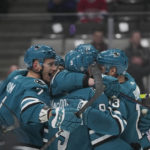 
              San Jose Sharks defenseman Jacob MacDonald, center, celebrates with teammates after scoring against the Montreal Canadiens during the first period of an NHL hockey game in San Jose, Calif., Tuesday, Feb. 28, 2023. (AP Photo/Godofredo A. Vásquez)
            