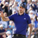 
              Nick Taylor acknowledges the crowd on the 18th hole during the final round of the Phoenix Open golf tournament, Sunday, Feb. 12, 2023, in Scottsdale, Ariz. (AP Photo/Darryl Webb)
            