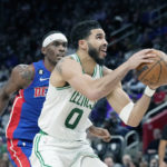 
              Boston Celtics forward Jayson Tatum (0) attempts a layup as Detroit Pistons guard Alec Burks defends during the first half of an NBA basketball game, Monday, Feb. 6, 2023, in Detroit. (AP Photo/Carlos Osorio)
            