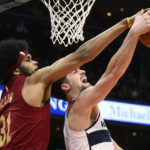 
              Cleveland Cavaliers center Jarrett Allen (31) and Washington Wizards forward Deni Avdija, right, battle for the ball during the first half of an NBA basketball game, Monday, Feb. 6, 2023, in Washington. (AP Photo/Nick Wass)
            