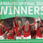 
              Manchester United's team players celebrate with the trophy as they won the English League Cup final soccer match between Manchester United and Newcastle United at Wembley Stadium in London, Sunday, Feb. 26, 2023. (AP Photo/Alastair Grant)
            