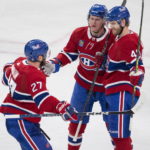 Montreal Canadiens right wing Joel Armia (40) celebrates with teammates Christian Dvorak (28) and Jonathan Drouin (27) after scoring during the third period of an NHL hockey game against the Chicago Blackhawks, Tuesday, Feb.14, 2023 in Montreal. (Ryan Remiorz/The Canadian Press via AP)