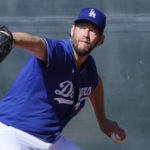 
              Los Angeles Dodgers starting pitcher Clayton Kershaw throws during the first day of spring training baseball workouts for Dodgers pitchers and catchers in Phoenix, Thursday, Feb. 16, 2023. (AP Photo/Ross D. Franklin)
            
