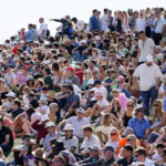 
              Fans crowd together on the 18th hole during the third round of the Phoenix Open golf tournament Saturday, Feb. 11, 2023, in Scottsdale, Ariz. (AP Photo/Darryl Webb)
            
