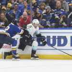 
              Seattle Kraken's Jordan Eberle (7) fights for the puck against St. Louis Blues' Justin Faulk (72) during the first period of an NHL hockey game on Tuesday, Feb. 28, 2023, in St. Louis. (AP Photo/Michael Thomas)
            