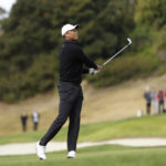 
              Tiger Woods watches his approach shot to the 17th hole during the second round of the Genesis Invitational golf tournament at Riviera Country Club, Friday, Feb. 17, 2023, in the Pacific Palisades area of Los Angeles. (AP Photo/Ryan Kang)
            