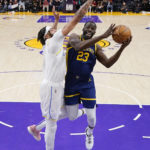 
              Golden State Warriors forward Draymond Green, right, shoots as Los Angeles Lakers forward Anthony Davis defends during the first half of an NBA basketball game Thursday, Feb. 23, 2023, in Los Angeles. (AP Photo/Mark J. Terrill)
            