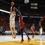 
              Tennessee forward Uros Plavsic (33) shoots over Alabama center Charles Bediako (14) during the first half of an NCAA college basketball game Wednesday, Feb. 15, 2023, in Knoxville, Tenn. (AP Photo/Wade Payne)
            