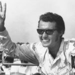 
              FILE - Stock car racer Richard Petty raises his fingers in victory after winning the 300-mile NASCAR Grand National race in Trenton, N.J., on July 13, 1970. (AP Photo/File)
            