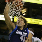 
              FILE - Dallas Mavericks' Dirk Nowitzki (41), of Germany, dunks against Boston Celtics' Delonte West during the fourth quarter of an NBA basketball game in Boston, Jan. 9, 2006. Nowitzki was announced Friday, Feb. 17, 2023, as being among the finalists for enshrinement later this year by the Basketball Hall of Fame. The class will be revealed on April 1. (AP Photo/Elise Amendola, File)
            