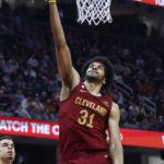 
              Cleveland Cavaliers center Jarrett Allen shoots against the Denver Nuggets during the first half of an NBA basketball game, Thursday, Feb. 23, 2023, in Cleveland. (AP Photo/Ron Schwane)
            