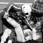 
              FILE - Bobby Allison, left, and Cale Yarborough fight after the Daytona 500 auto race in Daytona Beach, Fla., Feb. 18, 1979. Forty years later, it still resonates as one of the most important days in NASCAR history. (AP Photo/Ric Feld, File)
            