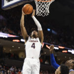 
              Virginia's Armaan Franklin (4) shoots the ball against Duke during the second half of an NCAA college basketball game in Charlottesville, Va., Saturday, Feb. 11, 2023. (AP Photo/Mike Kropf)
            