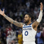 Minnesota Timberwolves guard D'Angelo Russell (0) celebrates after making a shot during the second half of an NBA basketball game against the Golden State Warriors, Wednesday, Feb. 1, 2023, in Minneapolis. (AP Photo/Abbie Parr)