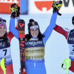 
              Italy's Federica Brignone, center, winner of an alpine ski, women's World Championship combined race, celebrates with second-placed Switzerland's Wendy Holdener, left, and third-placed Austria's Ricarda Haaser, in Meribel, France, Monday, Feb. 6, 2023. (AP Photo/Marco Trovati)
            