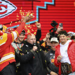 
              Kansas City Chiefs coach Andy Reid is showered with confetti by Carlos Dunlap as Patrick Mahomes, right, watches during the Chiefs' victory celebration and parade in Kansas City, Mo., Wednesday, Feb. 15, 2023. The Chiefs defeated the Philadelphia Eagles Sunday in the NFL Super Bowl 57 football game. (AP Photo/Reed Hoffmann)
            