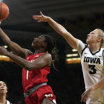 Maryland guard Diamond Miller (1) drives to the basket past Iowa guard Sydney Affolter (3) during the first half of an NCAA college basketball game, Thursday, Feb. 2, 2023, in Iowa City, Iowa. (AP Photo/Charlie Neibergall)