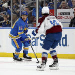St. Louis Blues' Robert Thomas (18) looks to pass the puck while under pressure from Colorado Avalanche's Alex Newhook (18) during the second period of an NHL hockey game Saturday, Feb. 18, 2023, in St. Louis. (AP Photo/Scott Kane)