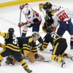 Washington Capitals' Nicklas Backstrom scores from behind Boston Bruins' Jeremy Swayman (1) during the first period of an NHL hockey game, Saturday, Feb. 11, 2023, in Boston. (AP Photo/Michael Dwyer)