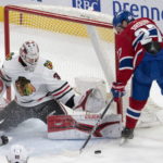 Montreal Canadiens left wing Jonathan Drouin (27) is stopped by Chicago Blackhawks goaltender Jaxson Stauber (30) during the second period of an NHL hockey game Tuesday, Feb. 14, 2023 in Montreal. (Ryan Remiorz/The Canadian Press via AP)