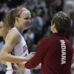 
              Indiana head coach Teri Moren talks, right, with Grace Berger after Berger was taken out of an NCAA college basketball game during the second half against Purdue, Sunday, Feb. 19, 2023, in Bloomington, Ind. (AP Photo/Darron Cummings)
            