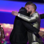 
              Walter Manning Player of the Year Award winner, Dallas Cowboys' Dak Prescott, right, hugs last year's recipient Calais Campbell during the NFL Honors award show ahead of the Super Bowl 57 football game,Thursday, Feb. 9, 2023, in Phoenix. (AP Photo/David J. Phillip)
            