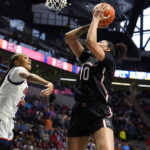 
              South Carolina center Kamilla Cardoso (10) shoots as Mississippi forward Madison Scott defends during the first half of an NCAA college basketball game in Oxford, Miss., Sunday, Feb. 19, 2023. (AP Photo/Rogelio V. Solis)
            