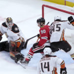 
              Anaheim Ducks' Colton White (45) keeps Chicago Blackhawks' Tyler Johnson (90) from getting a shot on goal off a pass from Patrick Kane as goaltender Anthony Stolarz also defends during the second period of an NHL hockey game Tuesday, Feb. 7, 2023, in Chicago. (AP Photo/Charles Rex Arbogast)
            
