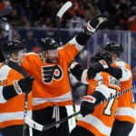 Philadelphia Flyers' Patrick Brown, from left, Nicolas Deslauriers, Tony DeAngelo, and Nick Seeler celebrate after a goal by Deslauriers during the second period of an NHL hockey game against the New York Islanders, Monday, Feb. 6, 2023, in Philadelphia. (AP Photo/Matt Slocum)