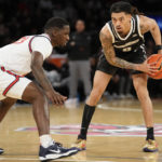 
              Providence guard Alyn Breed (0) plays against St. John's forward David Jones (23) during the first half of an NCAA college basketball game, Saturday, Feb. 11, 2023 in New York. (AP Photo/Bryan Woolston)
            