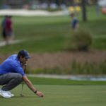 
              Adam Schenk lines up a putt on the fifth hole green, in the first round of the Honda Classic golf tournament, Thursday, Feb. 23, 2023, in Palm Beach Gardens, Fla. (AP Photo/Rebecca Blackwell)
            