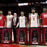 Maryland forward Donta Scott, forward Patrick Emilien, head coach Kevin Willard, guard Jahmir Young, guard Don Carey and guard Hakim Hart pose for photos during the Senior Day celebration before an NCAA college basketball game against Northwestern, Sunday, Feb. 26, 2023, in College Park, Md. Maryland won 75-59. (AP Photo/Julia Nikhinson)