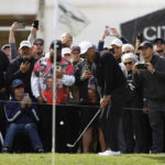 
              Tiger Woods chips to the third green during the second round of the Genesis Invitational golf tournament at Riviera Country Club, Friday, Feb. 17, 2023, in the Pacific Palisades area of Los Angeles. (AP Photo/Ryan Kang)
            