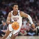 South Carolina guard Meechie Johnson dribbles the ball during the second half of the team's NCAA college basketball game against Alabama on Wednesday, Feb. 22, 2022, in Columbia, S.C. Alabama won 78-76 in overtime. (AP Photo/Sean Rayford)