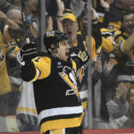 Pittsburgh Penguins center Evgeni Malkin (71) celebrates after a goal against the Tampa Bay Lightning during the second period of an NHL hockey game, Sunday, Feb. 26, 2023, in Pittsburgh. (AP Photo/Philip G. Pavely)
