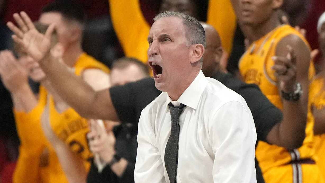 Arizona State head coach Bobby Hurley reacts after scoring a basket against Arizona during the seco...