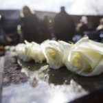 
              FILE - Roses are placed along the edge of the Memorial Fountain honoring the 75 lives lost in the 1970 plane crash, as Marshall University hosts its 49th annual Memorial Fountain Ceremony on Nov. 14, 2019, in Huntington, W.Va. West Virginia could soon have a new holiday to memorialize 75 people killed in the Marshall University plane crash more than 50 years ago. Democratic Del. Sean Hornbuckle is the lead sponsor of the legislation, which passed the House Government Organization Committee on Monday, Jan. 16, 2023. (Sholten Singer/The Herald-Dispatch via AP, File)
            