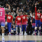 
              Washington Wizards guard Bradley Beal (3), left, celebrates towards the bench after making a three-point basket late in the second half of an NBA basketball game against the Minnesota Timberwolves, Thursday, Feb. 16, 2023, in Minneapolis. (AP Photo/Abbie Parr)
            