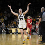 
              Iowa guard Caitlin Clark celebrates during the first half of an NCAA college basketball game against Maryland, Thursday, Feb. 2, 2023, in Iowa City, Iowa. (AP Photo/Charlie Neibergall)
            
