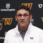 Washington Commanders head coach Ron Rivera introduces Eric Bieniemy as the new offensive coordinator and assistant head coach of the Commanders during a press conference in Ashburn, Va., Thursday, Feb. 23, 2023. (AP Photo/Luis M. Alvarez)