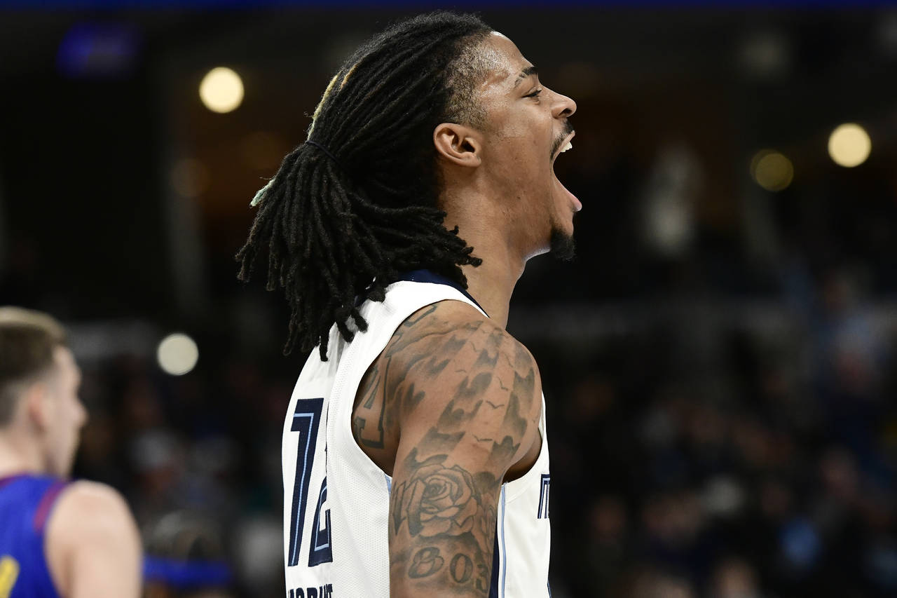 Memphis Grizzlies guard Ja Morant (12) shouts during the second half of the team's NBA basketball g...