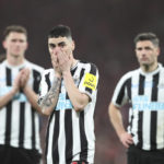 Newcastle's Miguel Almiron, centre, Newcastle's Fabian Schaer, right, and Newcastle's Sven Botman gesture after loosing the English League Cup final soccer match between Manchester United and Newcastle United at Wembley Stadium in London, Sunday, Feb. 26, 2023. Manchester United won 2-0. (AP Photo/Scott Heppell)