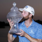 
              Chris Kirk kisses the trophy after winning the Honda Classic golf tournament in a playoff against Eric Cole, Sunday, Feb. 26, 2023, in Palm Beach Gardens, Fla. (AP Photo/Lynne Sladky)
            
