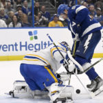 Tampa Bay Lightning center Steven Stamkos (91) looks for a shot against Buffalo Sabres goaltender Eric Comrie (31) during the second period of an NHL hockey game Thursday, Feb. 23, 2023, in Tampa, Fla. (AP Photo/Jason Behnken)