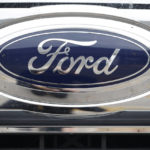 FILE - In this Oct. 20, 2019 file photograph, a Ford logo is displayed at a Ford dealership in Littleton, Colo. Ford will return to Formula One as the engine provider for Red Bull Racing in a partnership announced Friday, Feb. 3, 2023, that begins with immediate technical support this season and engines in 2026. (AP Photo/David Zalubowski, File)