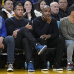 Minnesota Timberwolves co-owner Alex Rodriguez, middle left, and former baseball player Barry Bonds, middle right, watch during the first half of an NBA basketball game between the Golden State Warriors and the Timberwolves in San Francisco, Sunday, Feb. 26, 2023. (AP Photo/Jeff Chiu)