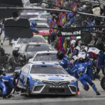 
              Christopher Bell (20) makes a pit stop during a NASCAR Cup Series auto race at Auto Club Speedway in Fontana, Calif., Sunday, Feb. 26, 2023. (AP Photo/Jae C. Hong)
            