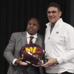 
              Eric Bieniemy, left, poses with Washington Commanders head coach Ron Rivera, right, after being introduced as the new offensive coordinator and assistant head coach of the Commanders during an NFL football press conference in Ashburn, Va., Thursday, Feb. 23, 2023. (AP Photo/Luis M. Alvarez)
            