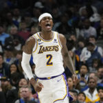 Los Angeles Lakers forward Jarred Vanderbilt (2) reacts after scoring during the second half of an NBA basketball game against the Dallas Mavericks in Dallas, Sunday, Feb. 26, 2023. (AP Photo/LM Otero)