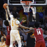 Tennessee forward Jonas Aidoo (0) blocks the shot of Alabama guard Mark Sears (1) as he goes for a shot during the first half of an NCAA college basketball game Wednesday, Feb. 15, 2023, in Knoxville, Tenn. (AP Photo/Wade Payne)